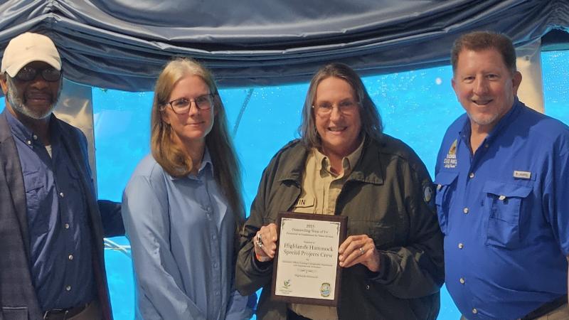 Volunteer receiving award.